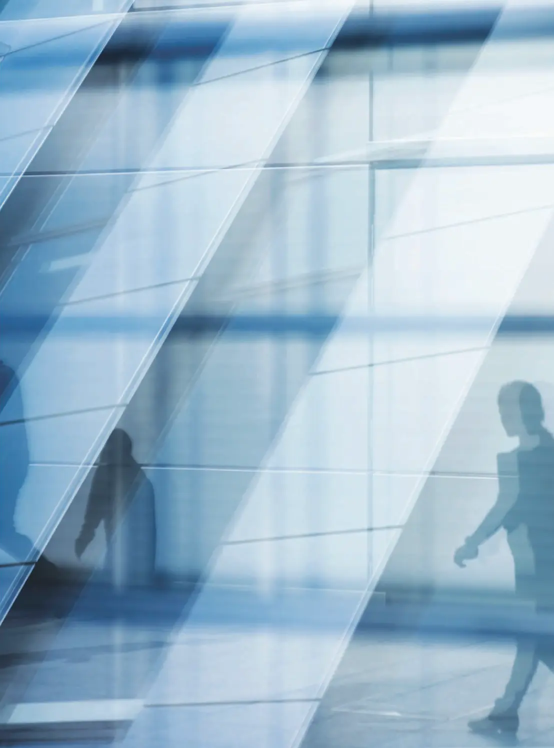 Reflections across a raking glass facade